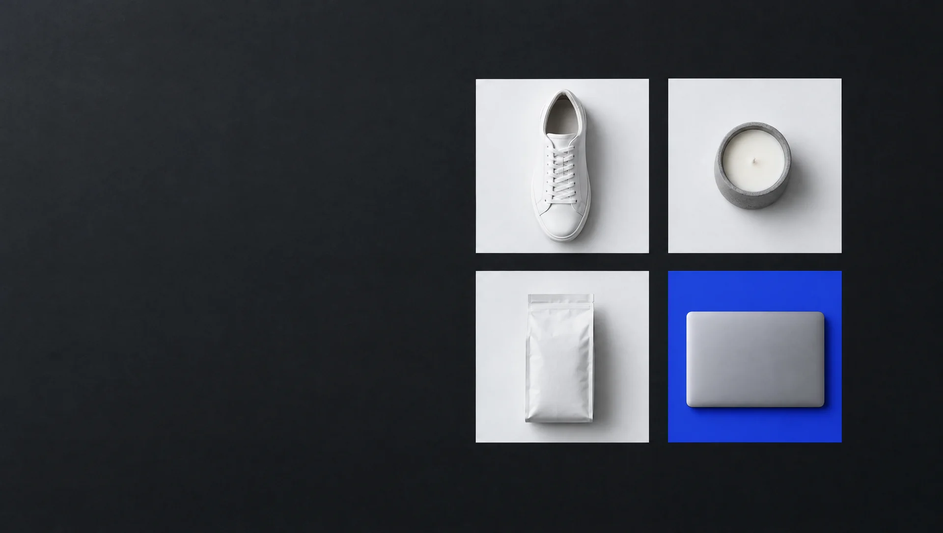 Overhead view of four paper squares on a black surface, holding a sneaker, a candle, a coffee bag and a closed laptop. The square under the laptop is blue.